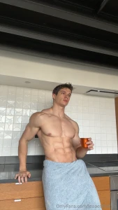 Topless with a hot cup in hand towel riding low over this thick hard