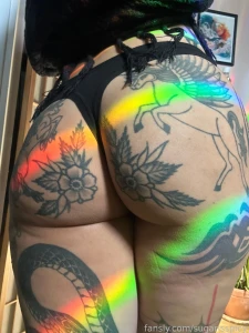 My butt and some rainbows from a reflective pendant hung in the window
