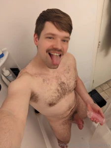 Stick out that tongue and slide a toy on that cock