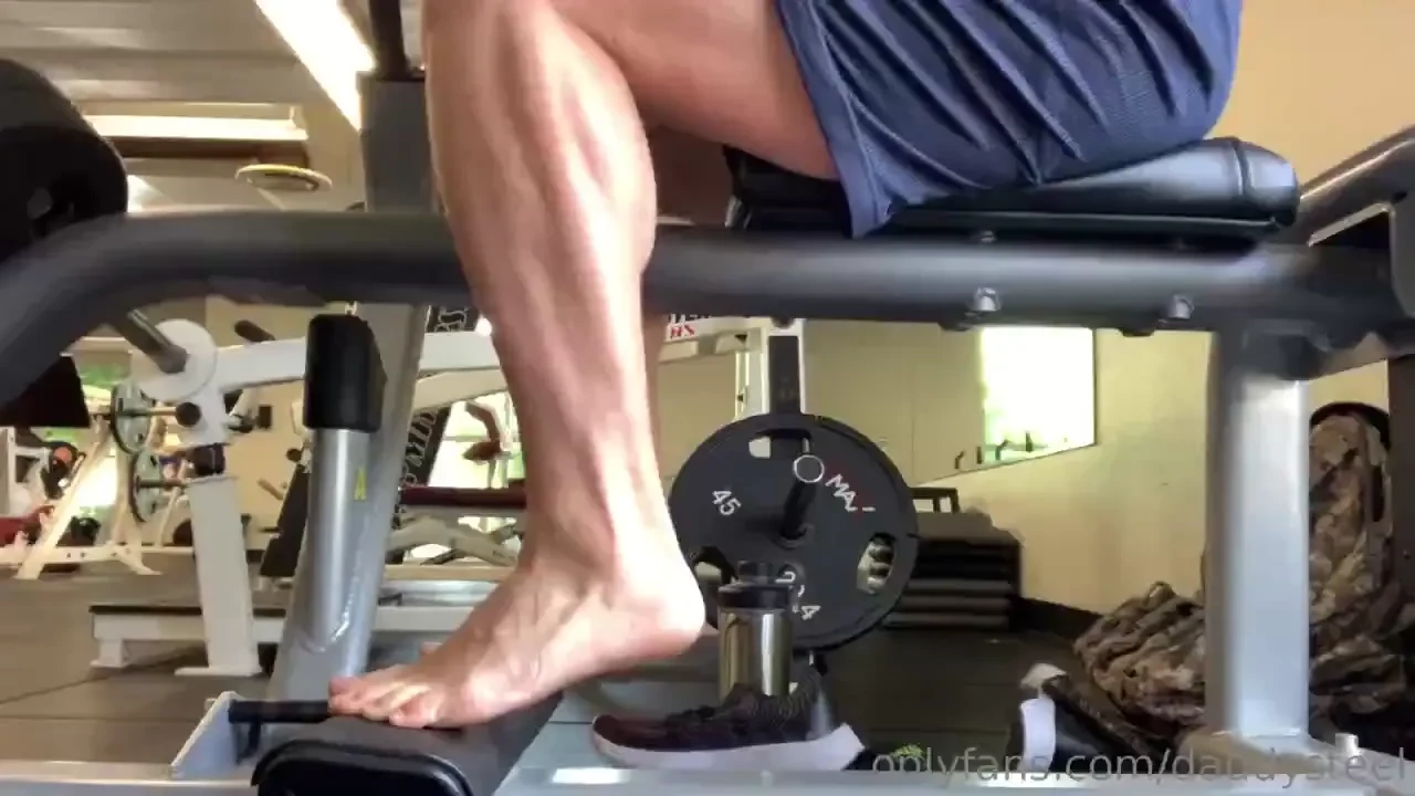 Barefoot calf raises in the gym 