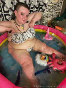 Watch me splash around in the tub lots of pics in my skimpy bikini