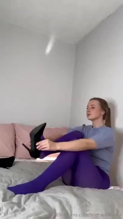 Putting heels on with these purple tights 