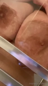 Tits pressed against the shower door
