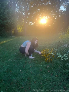 Sitting like a proper gremlin to check out some pretty flowers