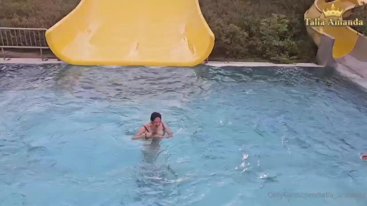 Hello watch how i go down fast from the slide in the swimming pool 