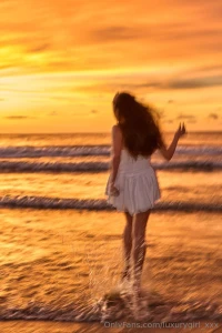 This morning light on the beach hides its secrets in a white dress part 1