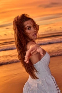 This morning light on the beach hides its secrets in a white dress