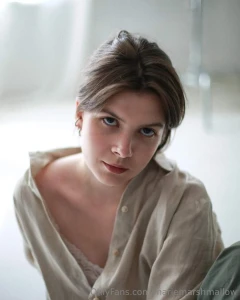 A gentle gaze with a touch of wistfulness - as if between silence and