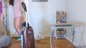 Ever wanted to spy on a hot chick vacuuming cheerios up off a wooden