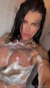 Hot steamy shower and lots of bubbles all over my big fake tits what s