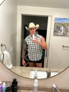 What do you like more my cowboy hat muscles or my bulge popping out