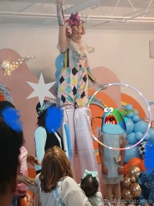 I got hired to be a stilt walker hula hooping in color themed costume