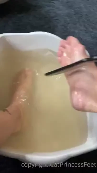 Foot detox bath soaked wrinkly feet natural nails and fresh pedicure 
