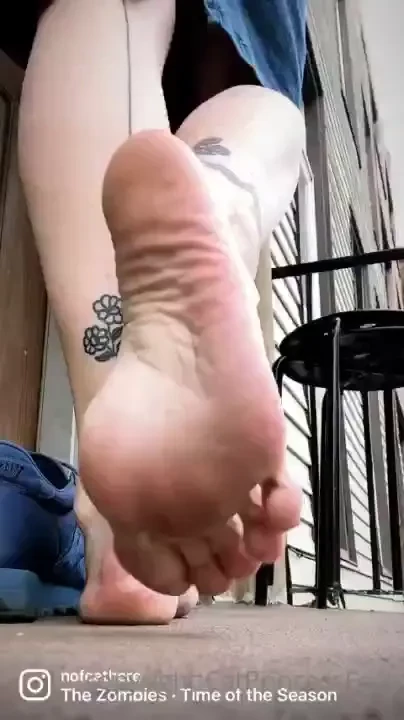 Barefoot in sneakers watch as i slip out of my old shoes and stretch 