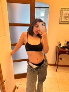 These pants are already unbuttoned your task is to remove them as