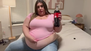 A coke bloat on top of a big meal makes a girl keep her huge bloated
