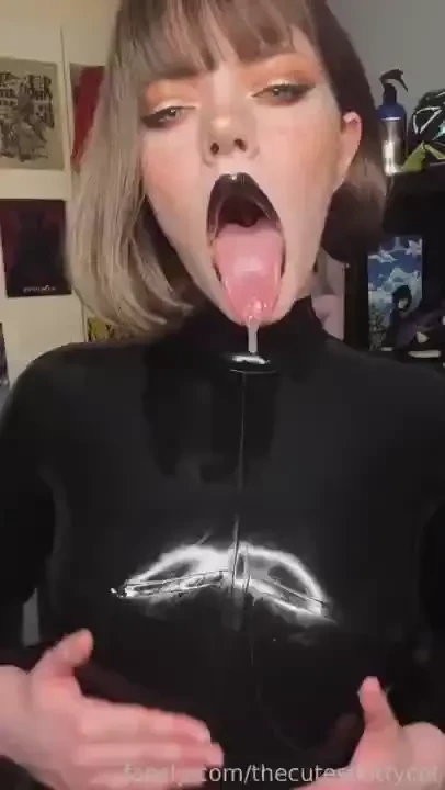 Dribbling all over my latex catsuit seducing you with my tongue and 