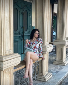 Gliding effortlessly in a sleek ensemble against a backdrop of