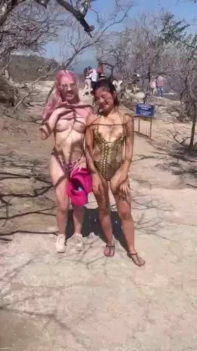 We got away with flashing our titties right behind this big group 