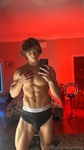 Mirror selfie red light glowing boxers tight around this hard cock if