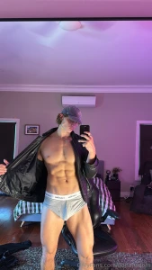 Leather open chest bare abs tight and this boxer barely holding it