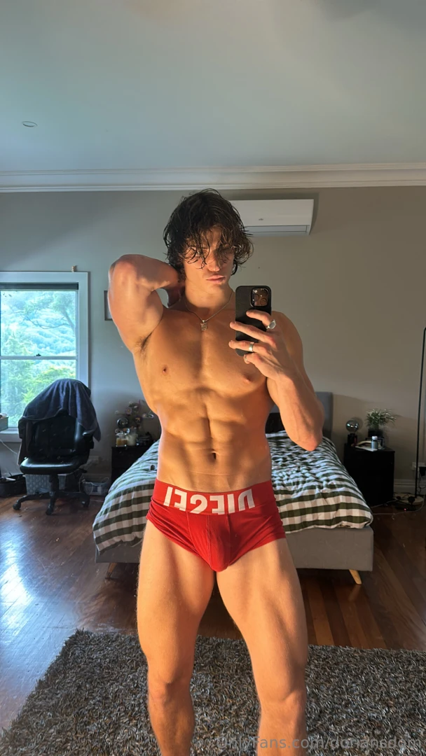 Mirror shot locked in biceps flexed abs chiseled and this thick hard 