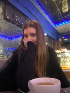 Nestled in a cozy corner of the caf wrapped in the warmth of a