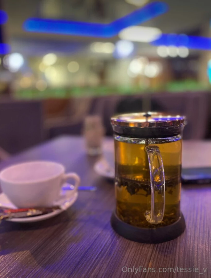 Savoring a cozy moment with a delightful cup of tea in the warmth of a 