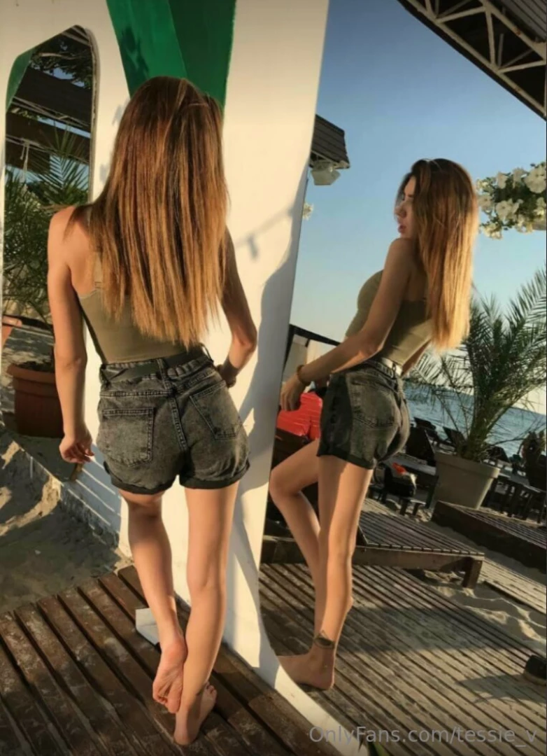 Reflections of serenity in the mirror framed by the elegance of palm 