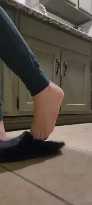 Sneaky feet stuff in the kitchen while cooking at my friend s house 