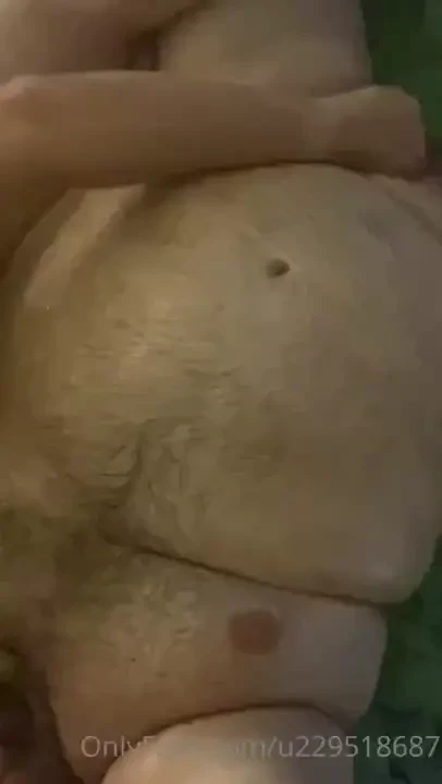 This big bear loves getting his huge belly rubbed with oil and his 