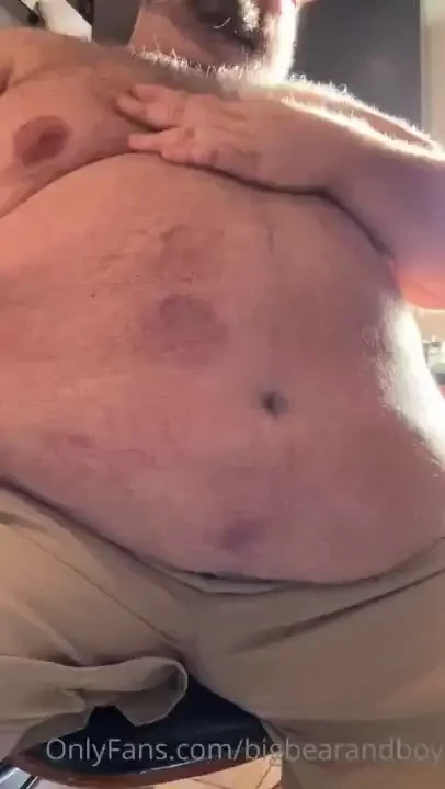Big daddy rubbing on his big belly 