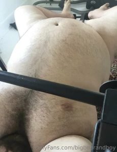 Big bear lifting weights naked