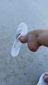 Dangling again white flip flop dangle and drop with arching at the end