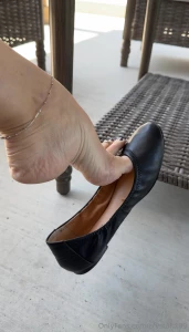 Holding on ballet flat shoeplay dangling barely holding on drop