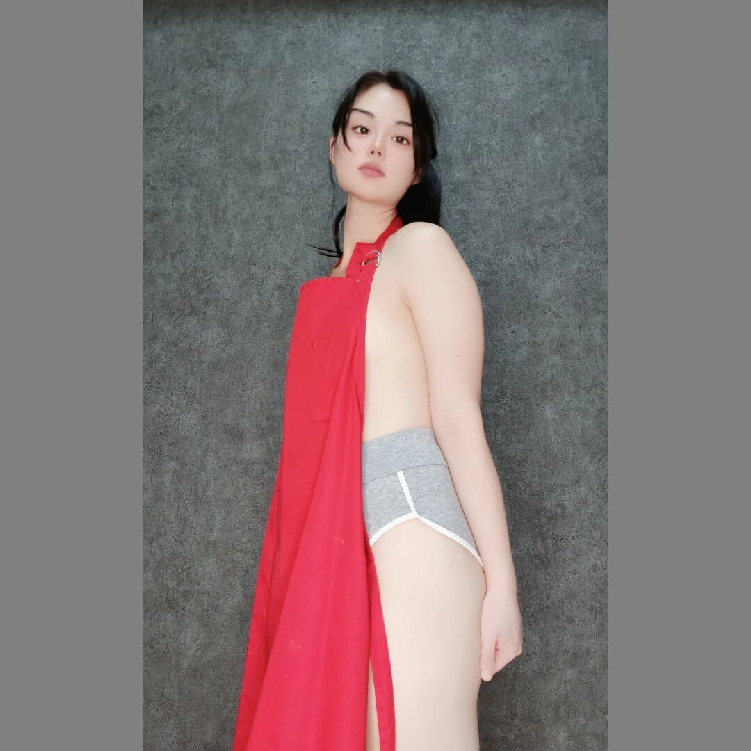 Only wearing the essentials in the kitchen apron included 