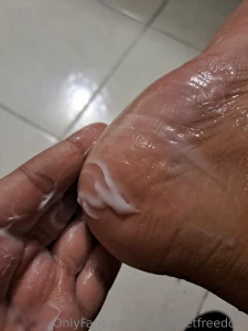 Cleaning and rubbing my tired feet with cream
