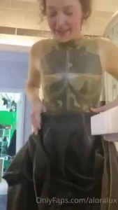 Getting out of a double dildo insertion latex bodysuit after filming