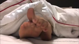 Former model jenny wiggling her nylon toes sticking out from under the