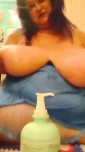 A plentiful and vigorous application of messy lotion to my huge melons