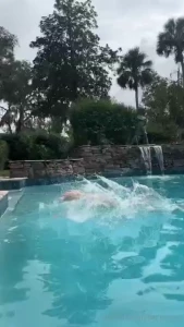Hanging out at the pool filming xmas content in my mistletoe undies