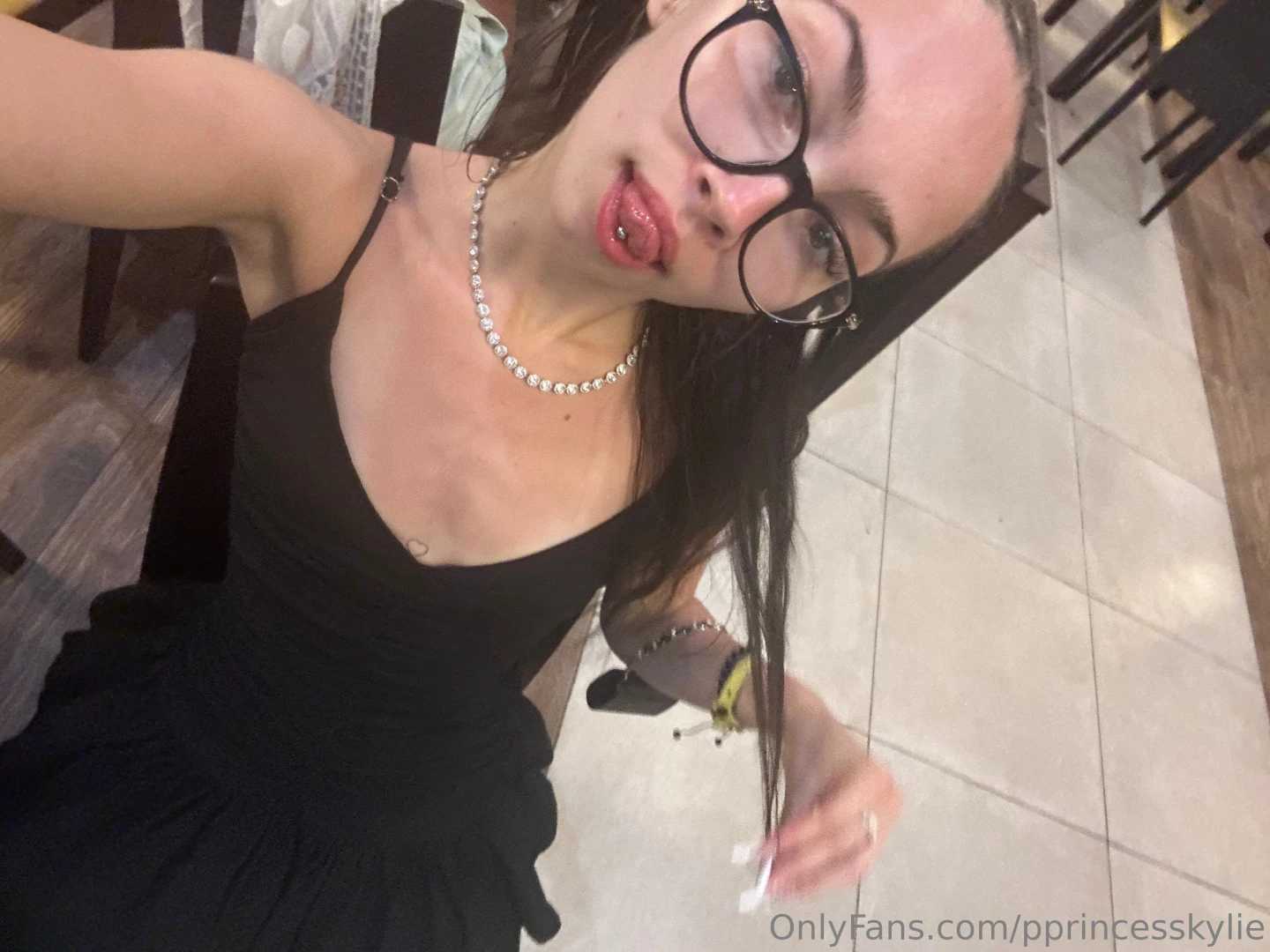 Glasses on and lips glossed 