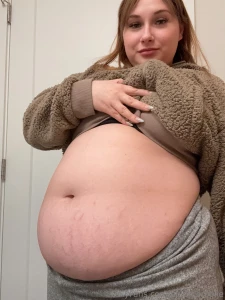 Post-pizza bloat a whole pizza and cheese bread and a cookie