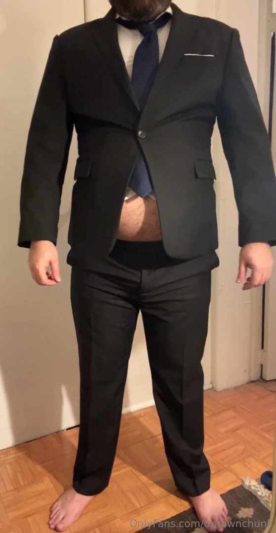 Trying on an old shirt and suit buttons were popped but nobody was 