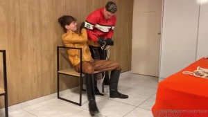 Leather boys are restrained and humiliated by their masters boots