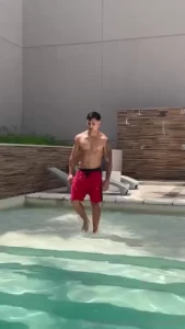 We get into the pool together