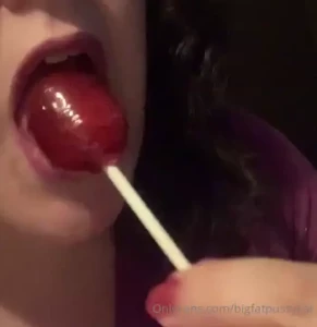 Big fat pussy kat licks a big fat lollipop