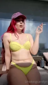 Smoking in a yellow bikini