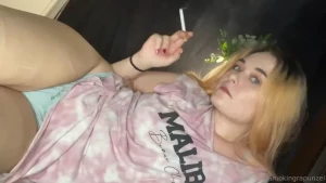 Last smoke of the day laying on my side with my thong showing
