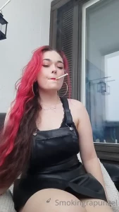 Smoking in a leather dress